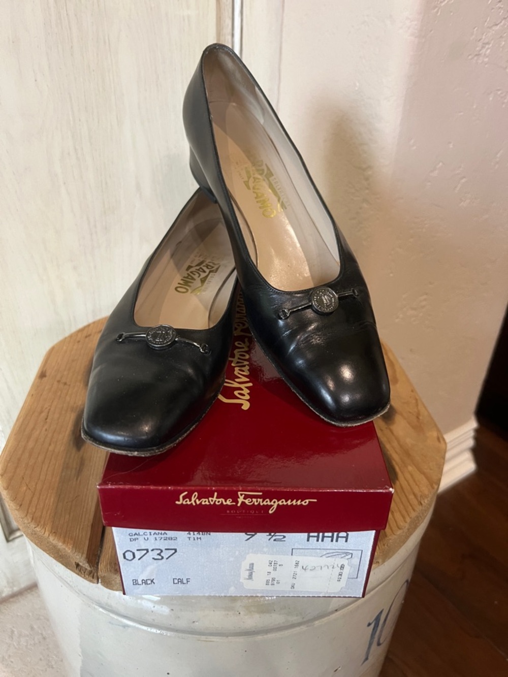 Salvatore Ferragamo Black Leather Slip-On Flats with Logo Medallion